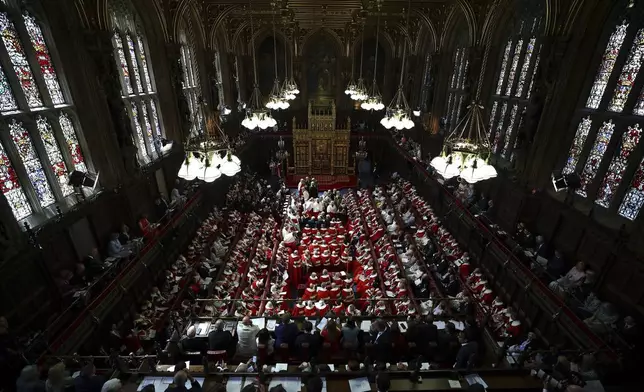 Members of the House of Lords and guests take their seats in the Lords Chamber, ahead of the State Opening of Parliament, in the Houses of Parliament, in London, Wednesday, July 17, 2024. (Henry Nicholls/POOL via AP)