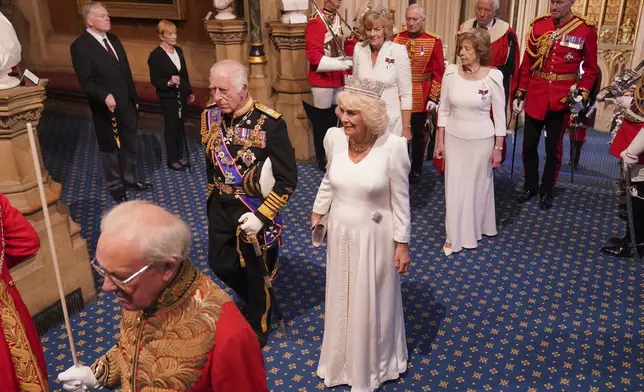 King Charles III and Queen Camilla arrive for the State Opening of Parliament in the House of Lords, at the Palace of Westminster in London, Wednesday, July 17, 2024. ( Jonathan Brady/POOL via AP)