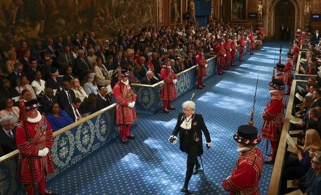 Sarah Clarke, the Black Rod, walks through the Royal Gallery on the day of the State Opening of Parliament at the Palace of Westminster in London, Wednesday, July 17, 2024. (Hannah McKay/POOL via AP)