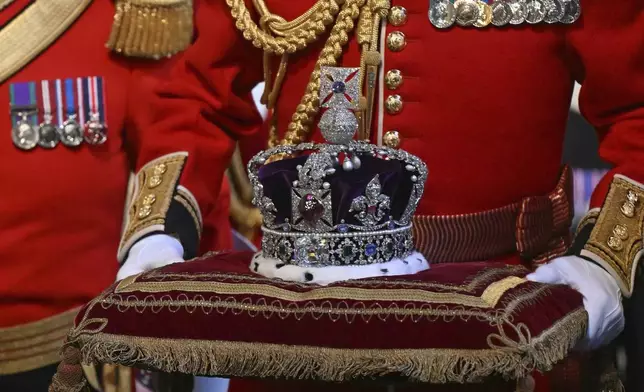 The Imperial State Crown is carried through the Norman Porch ahead of the State Opening of Parliament, at the Houses of Parliament, in London, Wednesday, July 17, 2024. (Justin Tallis/POOL via AP)