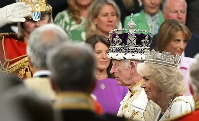 Britain's King Charles III wearing the Imperial State Crown and Britain's Queen Camilla, wearing the George IV State Diadem, attend the State Opening of Parliament, at the Houses of Parliament, in London, Wednesday, July 17, 2024. (Justin Tallis/POOL via AP)