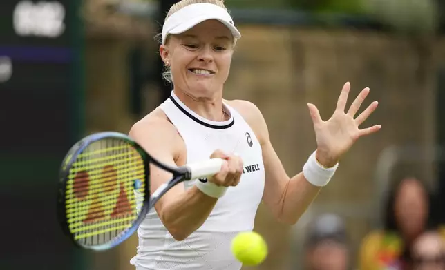 Harriet Dart of Britain plays a forehand return to Zhuoxuan Bai of China during their first round match at the Wimbledon tennis championships in London, Tuesday, July 2, 2024. (AP Photo/Mosa'ab Elshamy)
