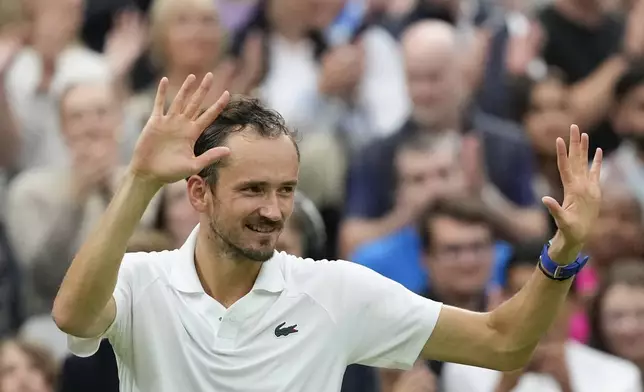 Daniil Medvedev of Russia celebrates after defeating Jannik Sinner of Italy in their quarterfinal match at the Wimbledon tennis championships in London, Tuesday, July 9, 2024. (AP Photo/Mosa'ab Elshamy)
