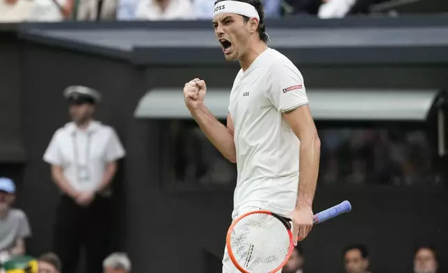 Taylor Fritz of the United States reacts during his fourth round match against Alexander Zverev of Germany at the Wimbledon tennis championships in London, Monday, July 8, 2024. (AP Photo/Kirsty Wigglesworth)