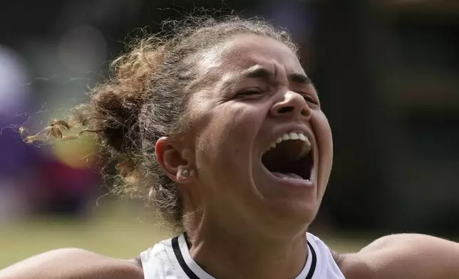Jasmine Paolini of Italy celebrates after defeating Donna Vekic of Croatia in their semifinal match at the Wimbledon tennis championships in London, Thursday, July 11, 2024. (AP Photo/Mosa'ab Elshamy)