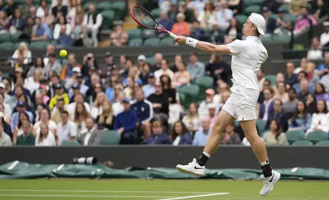 Denis Shapovalov of Canada plays a forehand return to Ben Shelton United States during their third round match at the Wimbledon tennis championships in London, Saturday, July 6, 2024. (AP Photo/Alberto Pezzali)