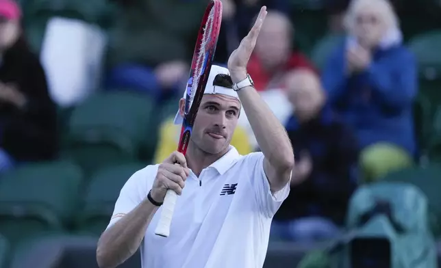 Tommy Paul of the United States celebrates after defeating Roberto Bautista Agut of Spain in their fourth round match at the Wimbledon tennis championships in London, Sunday, July 7, 2024. (AP Photo/Mosa'ab Elshamy)