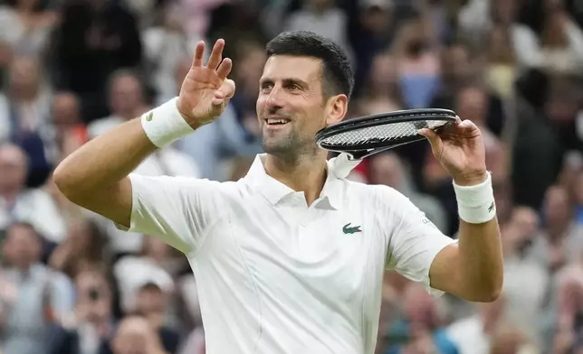 Novak Djokovic of Serbia reacts after defeating Alexei Popyrin of Australia in their third round match at the Wimbledon tennis championships in London, Saturday, July 6, 2024. (AP Photo/Kirsty Wigglesworth)