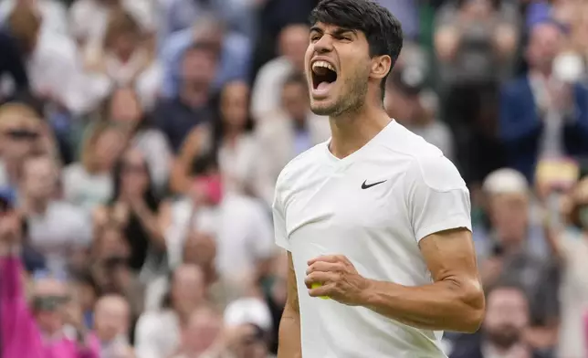 Carlos Alcaraz of Spain reacts during his fourth round match against Ugo Humbert of France at the Wimbledon tennis championships in London, Sunday, July 7, 2024. (AP Photo/Alberto Pezzali)