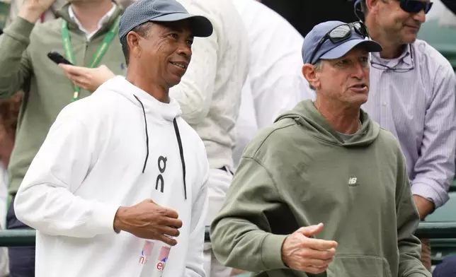 Bryan Shelton, left, father Ben Shelton of the United States leaves the stands following his son's third round match against Denis Shapovalov of Canada at the Wimbledon tennis championships in London, Saturday, July 6, 2024. (AP Photo/Alberto Pezzali)