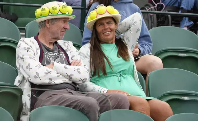 Spectators watch the Naomi Osaka of Japan and Diane Parry of France during their first round match of the Wimbledon tennis championships in London, Monday, July 1, 2024. (AP Photo/Kirsty Wigglesworth)