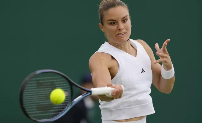 Maria Sakkari of Greece plays a forehand return to McCartney Kessler of the United States during their first round match of the Wimbledon tennis championships in London, Monday, July 1, 2024. (AP Photo/Kirsty Wigglesworth)