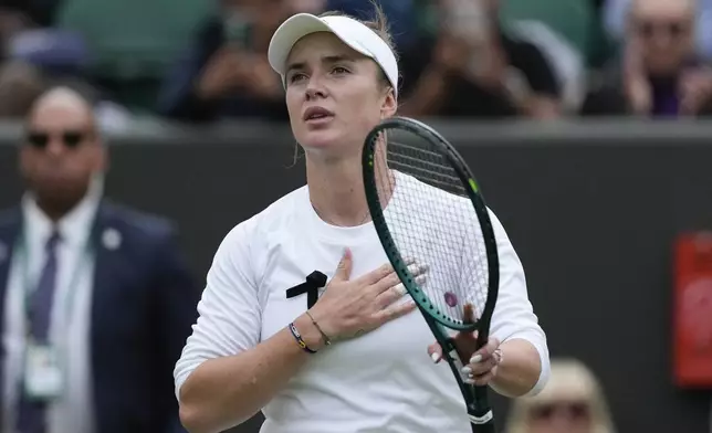 Elina Svitolina of Ukraine reacts after defeating Xinyu Wang of China in their fourth round match at the Wimbledon tennis championships in London, Monday, July 8, 2024. (AP Photo/Mosa'ab Elshamy)