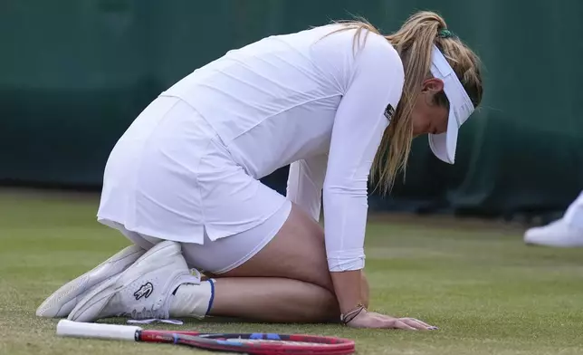 Donna Vekic of Croatia reacts after winning her fourth round match against Paula Badosa of Spain at the Wimbledon tennis championships in London, Sunday, July 7, 2024. (AP Photo/Mosa'ab Elshamy)