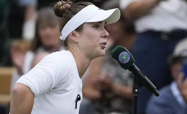 Elina Svitolina of Ukraine addresses the crowd defeating Xinyu Wang of China in their fourth round match at the Wimbledon tennis championships in London, Monday, July 8, 2024. (AP Photo/Mosa'ab Elshamy)