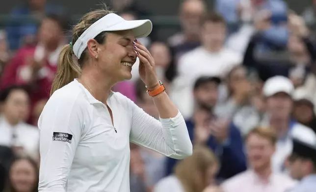 Donna Vekic of Croatia reacts after defeating Lulu Sun of New Zealand in their quarterfinal match at the Wimbledon tennis championships in London, Tuesday, July 9, 2024. (AP Photo/Mosa'ab Elshamy)