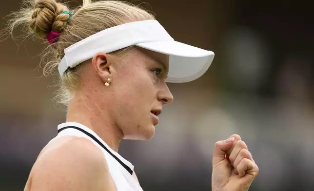 Harriet Dart of Britain reacts after winning a poiunt against Zhuoxuan Bai of China during their first round match at the Wimbledon tennis championships in London, Tuesday, July 2, 2024. (AP Photo/Mosa'ab Elshamy)