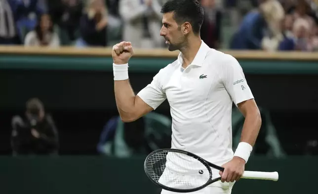 Novak Djokovic of Serbia celebrates after defeating Holger Rune of Denmark in their fourth round match at the Wimbledon tennis championships in London, Monday, July 8, 2024. (AP Photo/Kirsty Wigglesworth)