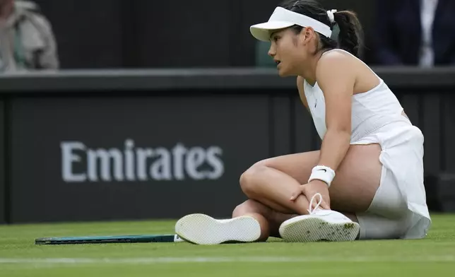 Emma Raducanu of Britain reacts after falling during her fourth round match against Lulu Sun of New Zealand at the Wimbledon tennis championships in London, Sunday, July 7, 2024. (AP Photo/Alberto Pezzali)