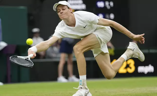 Jannik Sinner of Italy plays a forehand return to Daniil Medvedev of Russia during their quarterfinal match at the Wimbledon tennis championships in London, Tuesday, July 9, 2024. (AP Photo/Alberto Pezzali)