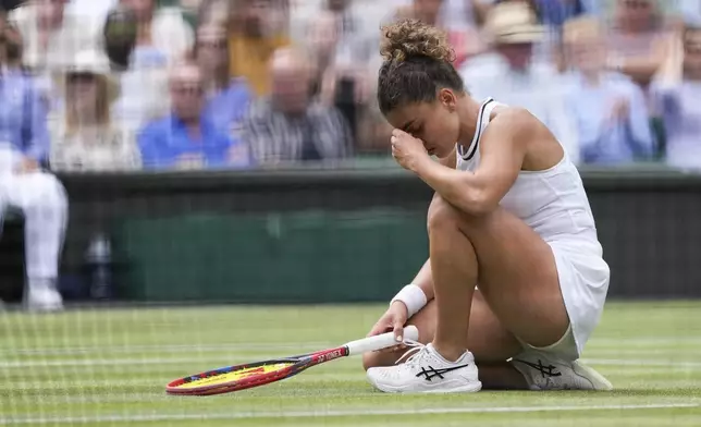 Jasmine Paolini of Italy reacts during her semifinal match against Donna Vekic of Croatia at the Wimbledon tennis championships in London, Thursday, July 11, 2024. (AP Photo/Alberto Pezzali)