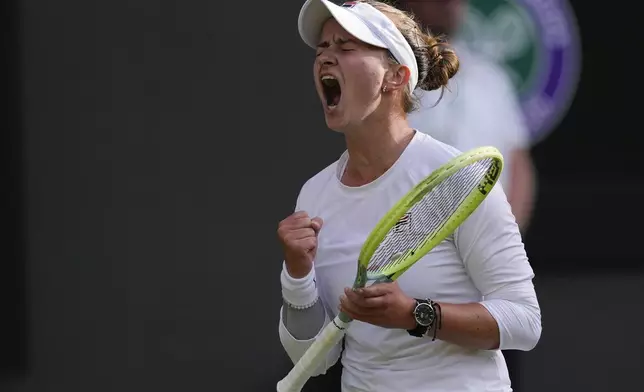 Barbora Krejcikova of the Czech Republic reacts during her semifinal match against Elena Rybakina of Kazakhstan at the Wimbledon tennis championships in London, Thursday, July 11, 2024. (AP Photo/Alberto Pezzali)