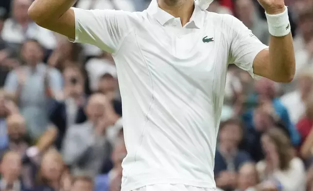 Novak Djokovic of Serbia reacts after defeating Alexei Popyrin of Australia in their third round match at the Wimbledon tennis championships in London, Saturday, July 6, 2024. (AP Photo/Kirsty Wigglesworth)