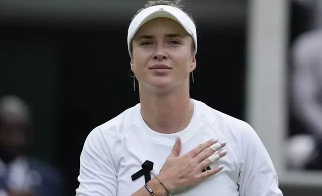 Elina Svitolina of Ukraine reacts after defeating Xinyu Wang of China in their fourth round match at the Wimbledon tennis championships in London, Monday, July 8, 2024. (AP Photo/Mosa'ab Elshamy)