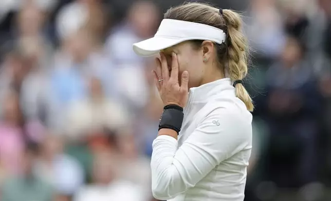 Anna Kalinskaya of Russia reacts during her fourth round match against Elena Rybakina of Kazakhstan at the Wimbledon tennis championships in London, Monday, July 8, 2024. (AP Photo/Kirsty Wigglesworth)