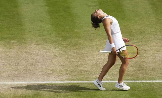 Jasmine Paolini of Italy reacts during her semifinal match against Donna Vekic of Croatia at the Wimbledon tennis championships in London, Thursday, July 11, 2024. (AP Photo/Kirsty Wigglesworth)