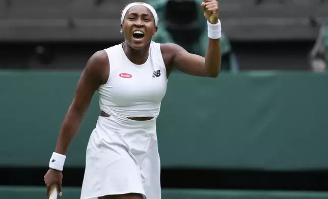 Coco Gauff of the United States reacts after winning a point against compatriot Caroline Dolehide during their first round match of the Wimbledon tennis championships in London, Monday, July 1, 2024. (AP Photo/Alberto Pezzali)