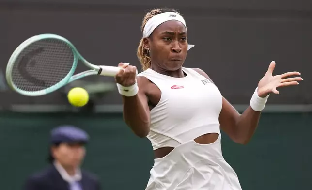 Coco Gauff of the United States plays a forehand return to Anca Todoni of Romania during their match on day three at the Wimbledon tennis championships in London, Wednesday, July 3, 2024. (AP Photo/Mosa'ab Elshamy)