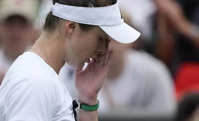 Elina Svitolina of Ukraine reacts after defeating Xinyu Wang of China in their fourth round match at the Wimbledon tennis championships in London, Monday, July 8, 2024. (AP Photo/Mosa'ab Elshamy)