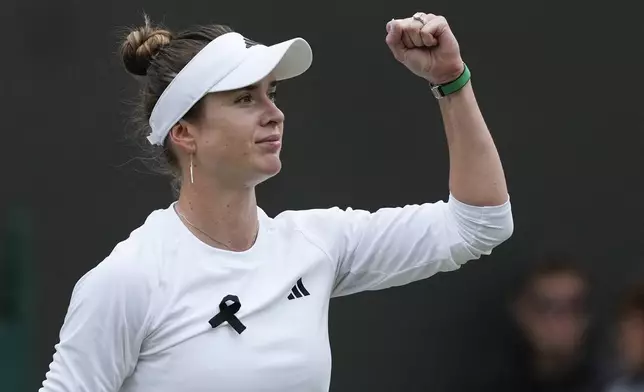 Elina Svitolina of Ukraine reacts after defeating Xinyu Wang of China in their fourth round match at the Wimbledon tennis championships in London, Monday, July 8, 2024. (AP Photo/Mosa'ab Elshamy)