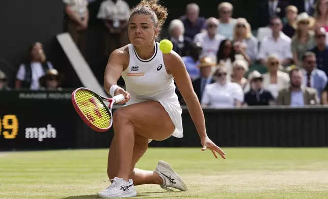 Jasmine Paolini of Italy plays a forehand return to Donna Vekic of Croatia during their semifinal match at the Wimbledon tennis championships in London, Thursday, July 11, 2024. (AP Photo/Alberto Pezzali)