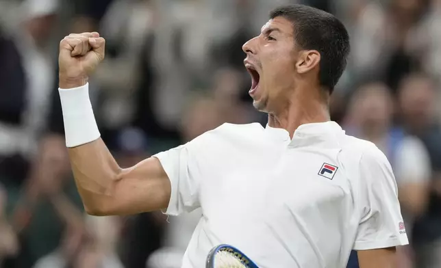 Alexei Popyrin of Australia reacts after winning a point against Novak Djokovic of Serbia during their third round match at the Wimbledon tennis championships in London, Saturday, July 6, 2024. (AP Photo/Kirsty Wigglesworth)