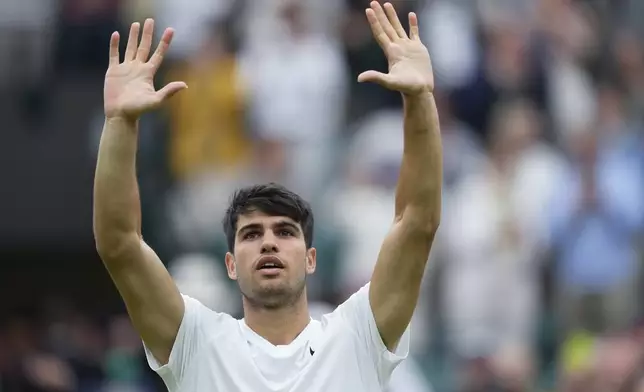 Carlos Alcaraz of Spain celebrates after defeating Aleksandar Vukic of Australia during their match on day three at the Wimbledon tennis championships in London, Wednesday, July 3, 2024. (AP Photo/Mosa'ab Elshamy)