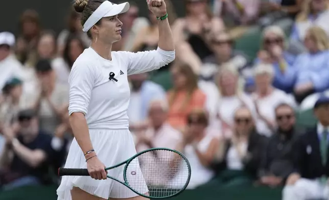 Elina Svitolina of Ukraine reacts after defeating Xinyu Wang of China in their fourth round match at the Wimbledon tennis championships in London, Monday, July 8, 2024. (AP Photo/Mosa'ab Elshamy)