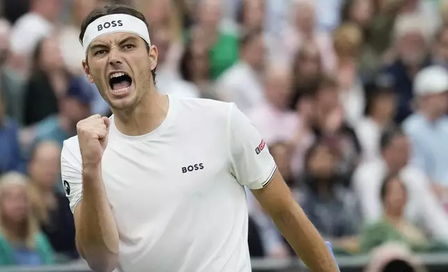 Taylor Fritz of the United States reacts during his fourth round match against Alexander Zverev of Germany at the Wimbledon tennis championships in London, Monday, July 8, 2024. (AP Photo/Mosa'ab Elshamy)