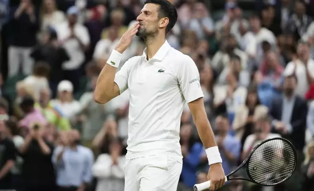 Novak Djokovic of Serbia celebrates after defeating Holger Rune of Denmark in their fourth round match at the Wimbledon tennis championships in London, Monday, July 8, 2024. (AP Photo/Kirsty Wigglesworth)