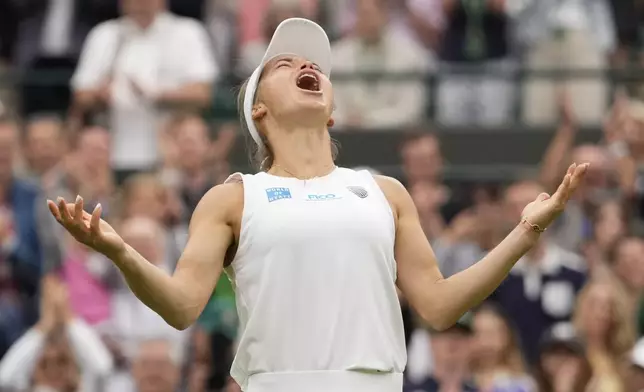 Yulia Putintseva of Kazakhstan celebrates after defeating Iga Swiatek of Poland in their third round match at the Wimbledon tennis championships in London, Saturday, July 6, 2024. (AP Photo/Alberto Pezzali)