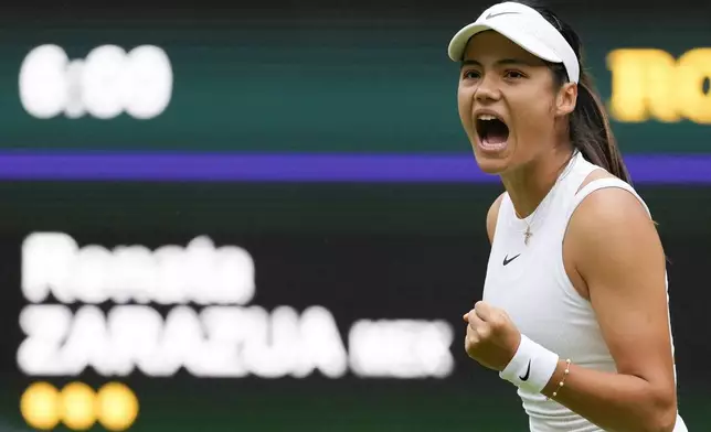 Emma Raducanu of Britain reacts after winning a point against Renata Zarazua of Mexico during their first round match of the Wimbledon tennis championships in London, Monday, July 1, 2024. (AP Photo/Alberto Pezzali)