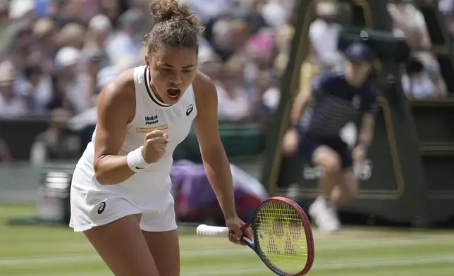 Jasmine Paolini of Italy celebrates winning a point against Donna Vekic of Croatia during their semifinal match at the Wimbledon tennis championships in London, Thursday, July 11, 2024. (AP Photo/Mosa'ab Elshamy)