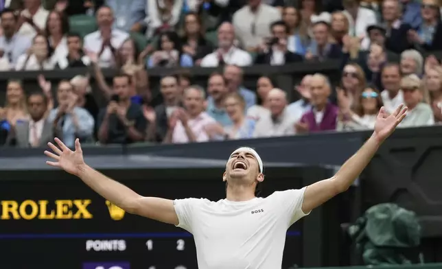 Taylor Fritz of the United States celebrates after defeating Alexander Zverev of Germany in their fourth round match at the Wimbledon tennis championships in London, Monday, July 8, 2024. (AP Photo/Kirsty Wigglesworth)