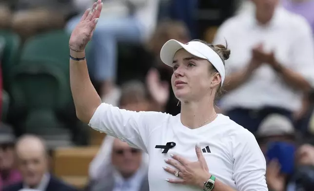 Elina Svitolina of Ukraine waves after defeating Xinyu Wang of China in their fourth round match at the Wimbledon tennis championships in London, Monday, July 8, 2024. (AP Photo/Mosa'ab Elshamy)