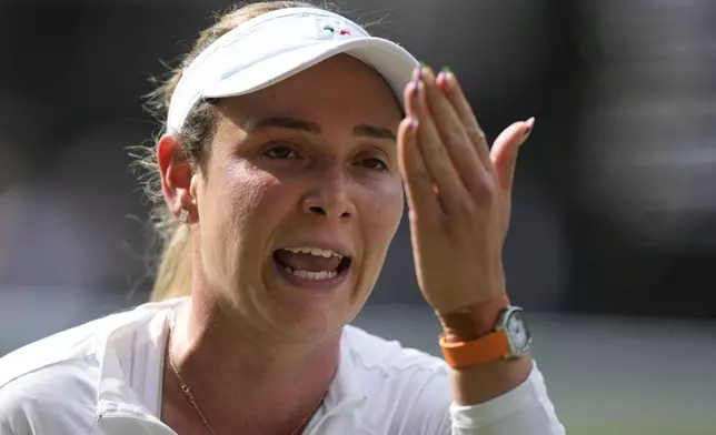 Donna Vekic of Croatia reacts after loosing a point against Jasmine Paolini of Italy during their semifinal match at the Wimbledon tennis championships in London, Thursday, July 11, 2024. (AP Photo/Mosa'ab Elshamy)