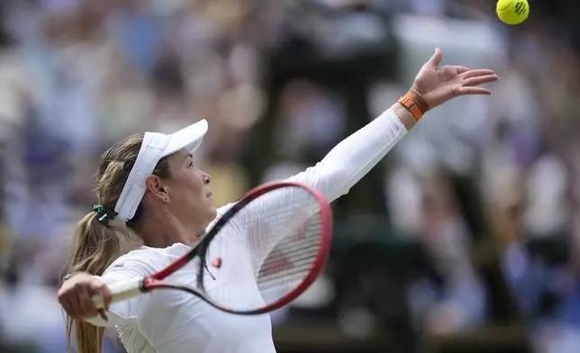 Donna Vekic of Croatia serves to Jasmine Paolini of Italy during their semifinal match at the Wimbledon tennis championships in London, Thursday, July 11, 2024. (AP Photo/Mosa'ab Elshamy)