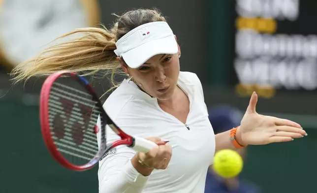 Donna Vekic of Croatia plays a forehand return to Lulu Sun of New Zealand during their quarterfinal match at the Wimbledon tennis championships in London, Tuesday, July 9, 2024. (AP Photo/Mosa'ab Elshamy)
