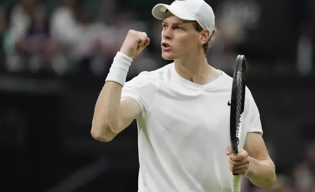 Jannik Sinner of Italy reacts after winning a point during his second round match against compatriot Matteo Berrettini on day three at the Wimbledon tennis championships in London, Wednesday, July 3, 2024. (AP Photo/Alberto Pezzali)