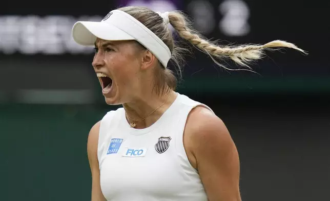 Yulia Putintseva of Kazakhstan reacts after winning a point against Iga Swiatek of Poland during their third round match at the Wimbledon tennis championships in London, Saturday, July 6, 2024. (AP Photo/Alberto Pezzali)